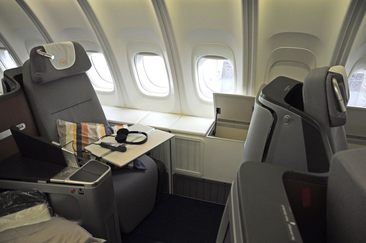 Lufthansa's business-class seat can be flattened to make a 1.98-meter bed. It felt a little snug for our 188 cm model (wearing shoes), but lowering arm rests and a hollow center console added to the comfort. Lufthansa says 1,340 passengers tested its new seat.