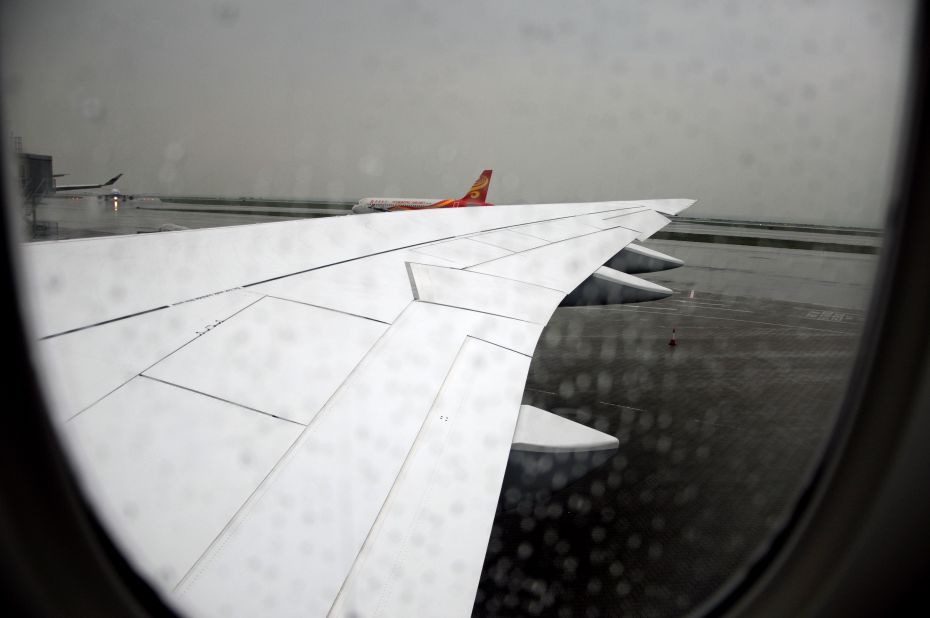 If you didn't notice it in the first two images, this photo taken through a rain-stained window shows the new wing. The Boeing 747-8 has done away with its recognizable winglets. The new raked wingtip design improves aerodynamics, reducing fuel use. The same design is used on the 787 Dreamliner. The 747-8 is 14% more fuel efficient than its predecessor, according to Boeing. Lufthansa says fuel efficiency has been 1% better than forecast. The noise footprint of the plane is about 30% smaller than for the 747-400.