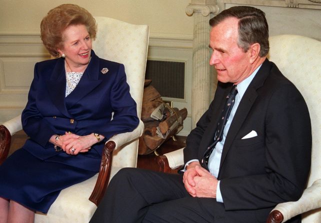 [File photo] Margaret Thatcher with U.S. President George H.W. Bush in the White House Oval Office, before receiving the medal of Freedom in an East Room ceremony on March 7, 1991. Bush has confirmed he will not be attending Thatcher's funeral.