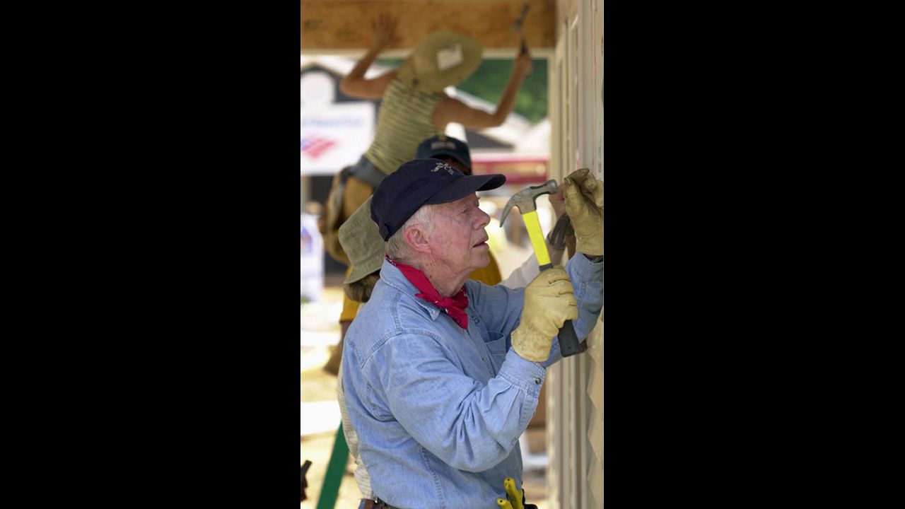 President Jimmy Carter works on a Habitat for Humanity home in LaGrange, Georgia, in 2003.