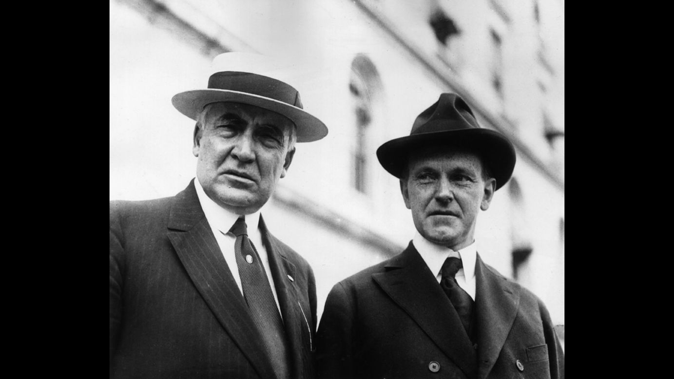 President Warren G. Harding, left, sports a straw boater, while Vice President Calvin Coolidge chooses a fedora, in 1922.