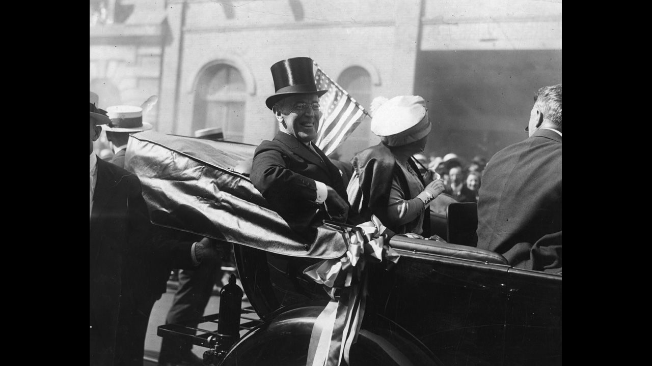 In 1920 in New York, the occasion calls for a top hat for President Woodrow Wilson.