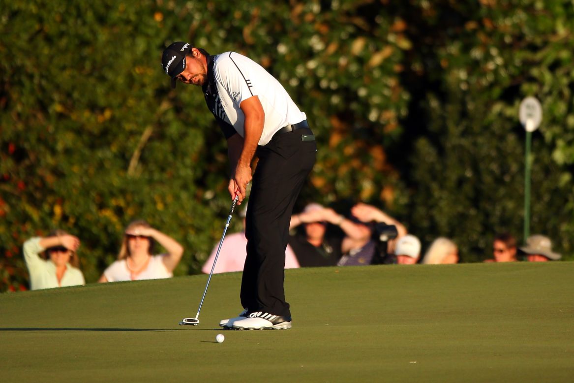Jason Day of Australia putts on the 17th hole during the second round of the Masters.