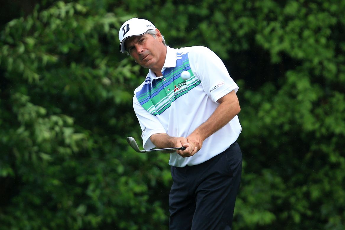 Fred Couples of the United States hits a shot on the fifth hole.