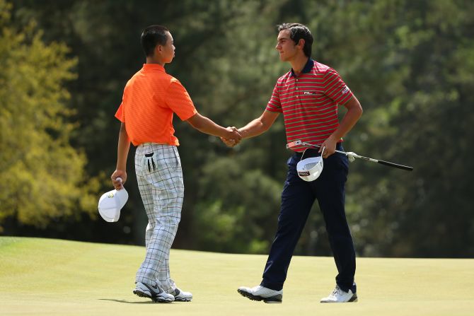 Guan Tianlang of China shakes hands with Matteo Manassero of Italy after the second round of the 2013 Masters Tournament at Augusta National Golf Club on Friday, April 12, in Augusta, Georgia. Click through to see all the shots from the second day and <a href="index.php?page=&url=http%3A%2F%2Fwww.cnn.com%2F2013%2F04%2F11%2Fgolf%2Fgallery%2Fmasters-round-one%2Findex.html" target="_blank">look back at the first round</a>.