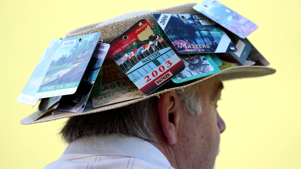 A man watches the third round of the 2013 Masters Tournament.