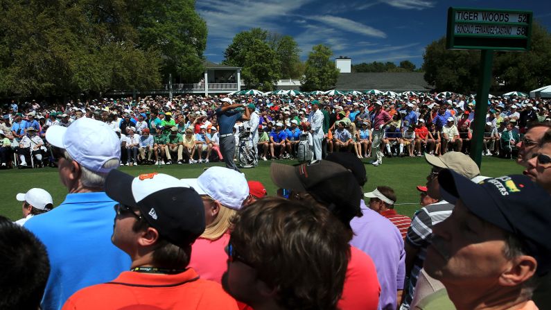 Tiger Woods of the U.S. tees off on the first hole.