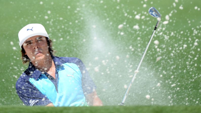 Rickie Fowler of the U.S. hits out of the bunker on the second hole.