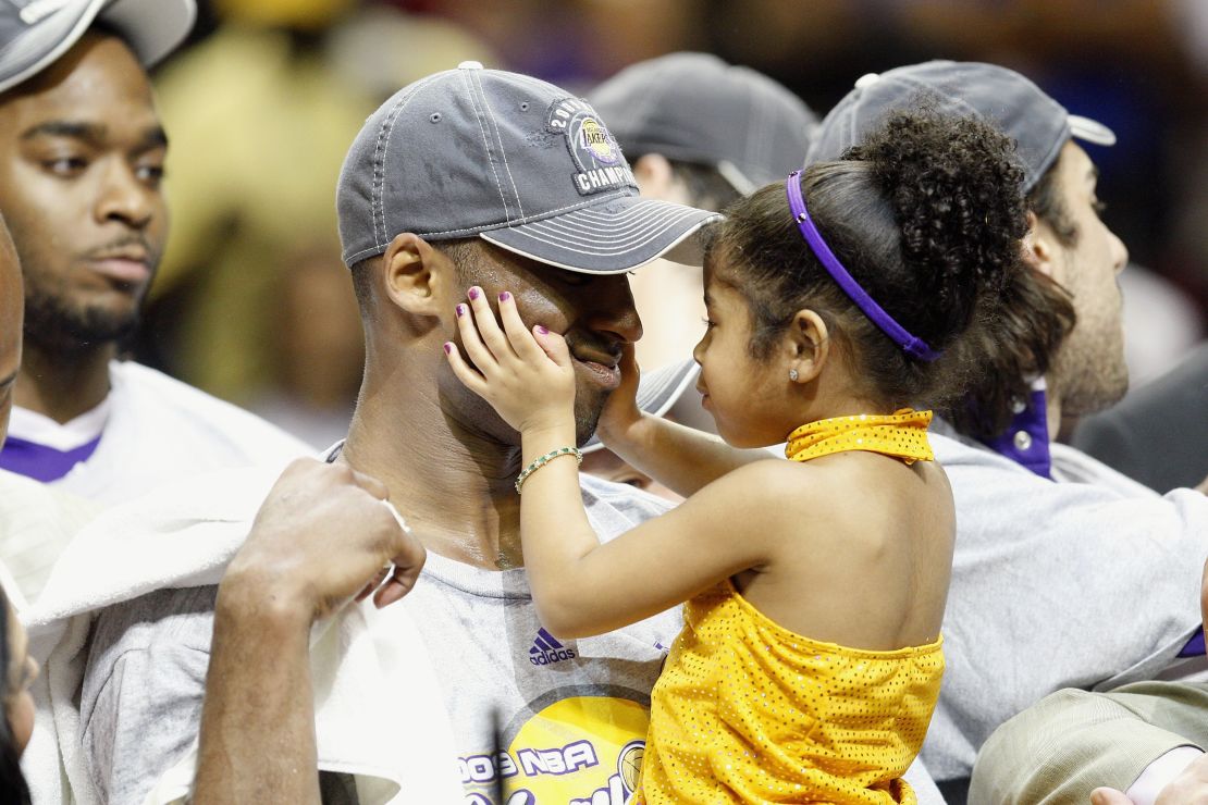 Kobe Bryant holds his daughter, Gianna, after the Lakers defeated the Orlando Magic in Game 5 of the 2009 NBA Finals on June 14, 2009, at Amway Arena in Orlando.