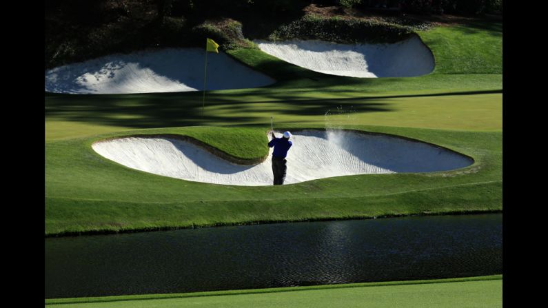 Angel Cabrera of Argentina plays his second shot on the 12th hole.