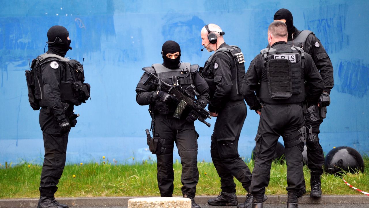Members of the Eris police service invastigate at the Sequedin prison, on April 13, 2013 in Sequedin, after one of France's most dangerous gangsters, known for brazen attacks on cash-in-transit vehicles, today blasted his way out of jail after taking several wardens hostage. Redoine Faid, who risked a heavy sentence over the 2010 death of a policewoman, used explosives to blast through five prison doors and break free in the northern town of Sequedin. AFP PHOTO PHILIPPE HUGUEN (Photo credit should read PHILIPPE HUGUEN/AFP/Getty Images) 