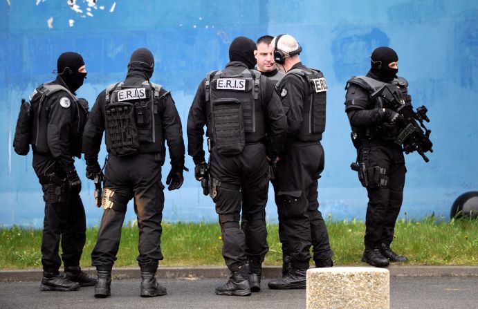 Members of the Eris Police service investigate at the prison.