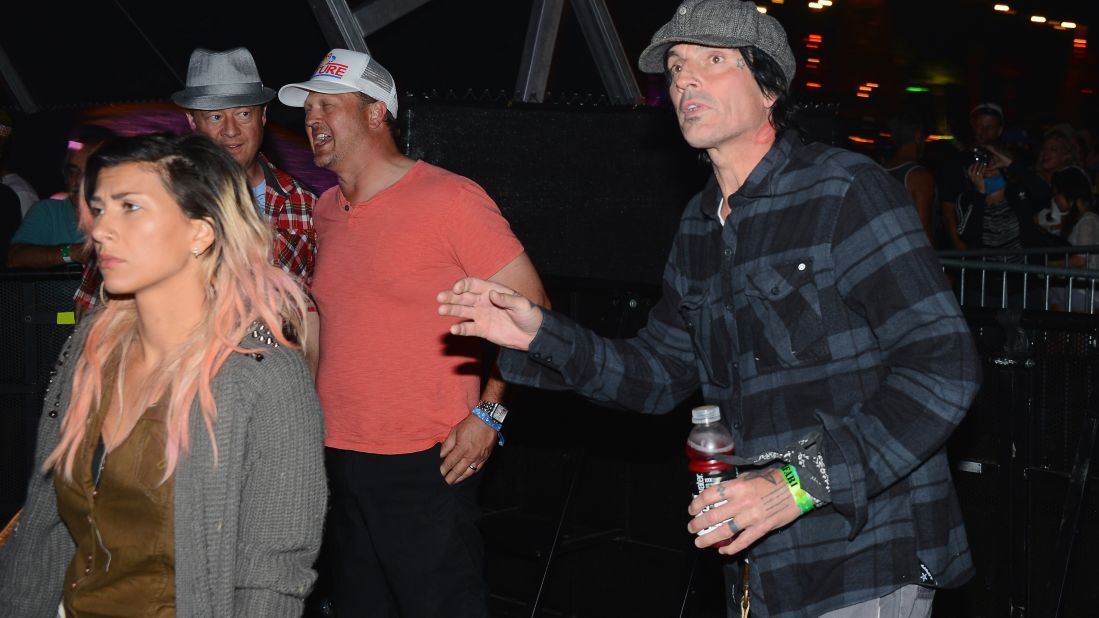 Tommy Lee, right, attends Day One of the festival.