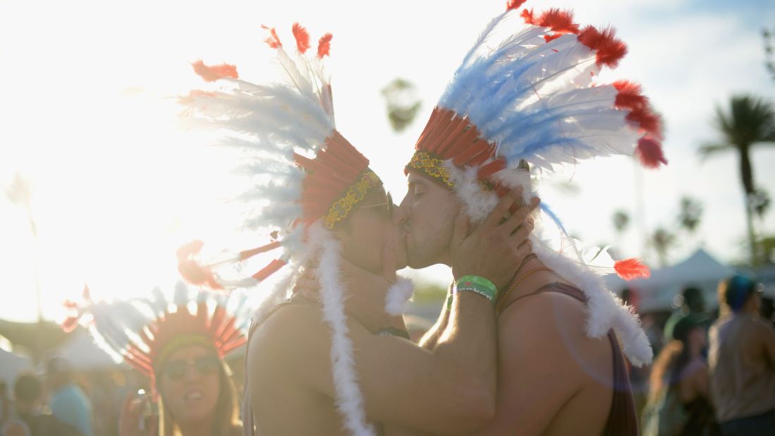 Two men kiss on Day Two of the festival on April 13.