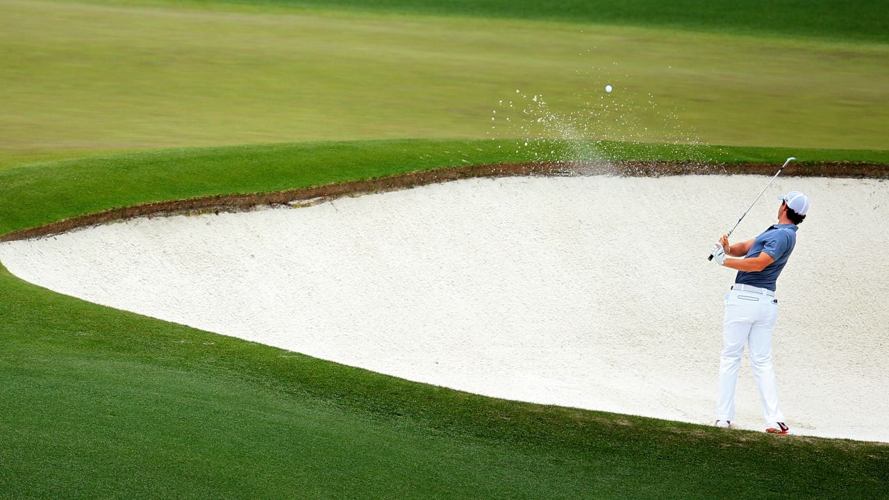 Rory McIlroy of Northern Ireland hits his second shot on the fourth hole.