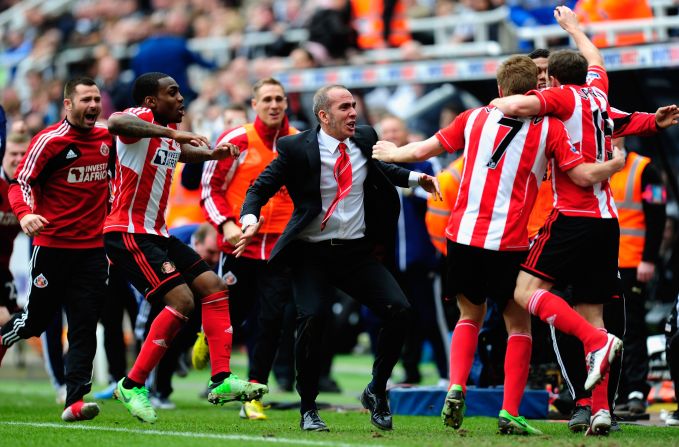 Di Canio celebrates with his Sunderland players during their crucial victory. Sunderland is now three points clear of the relegation zone with five games remaining.