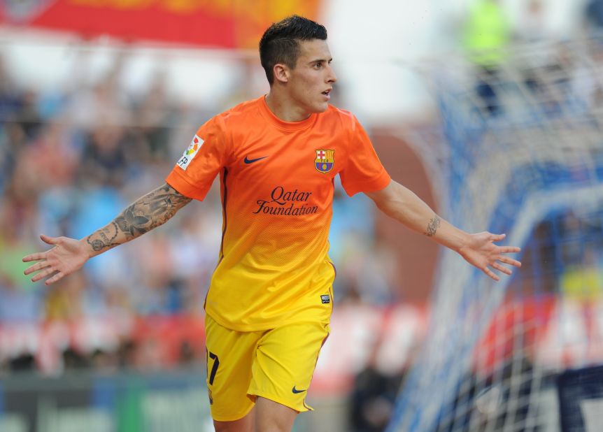 Cristian Tello scored twice as Barcelona, playing without talisman Lionel Messi, eased to a 3-0 win at Real Zaragoza to keep its title bid on track.