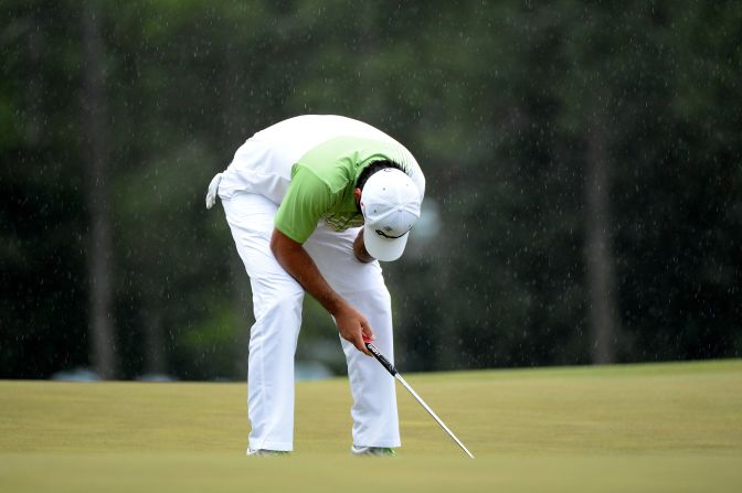 Jason Day of Australia reacts after missing a birdie putt on the 18th green.
