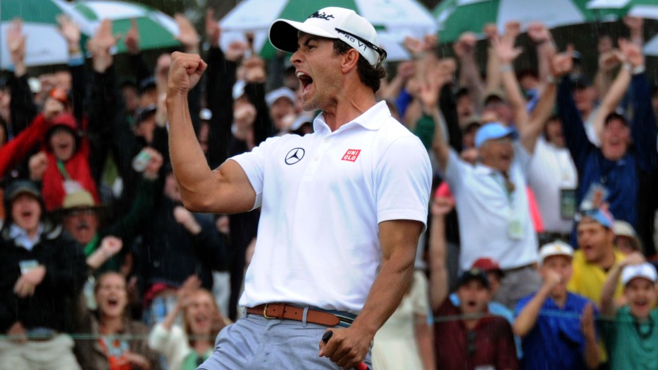 Adam Scott of Australia celebrates after he sinks a birdie putt on the 18th.