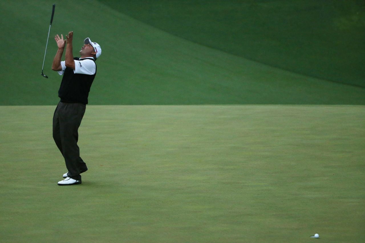 Angel Cabrera flips his putter after missing a birdie putt on the second sudden-death playoff hole.
