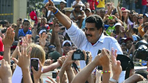 Nicolas Maduro waves at supporters after casting his vote in Caracas, Venezuela, on Sunday.