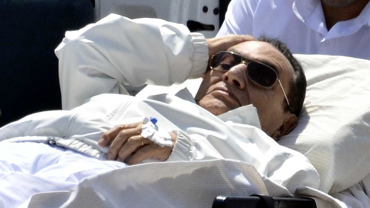 Ousted Egyptian president Hosni Mubarak is wheeled out of an ambulance following a hearing in Cairo on April 13, 2013.