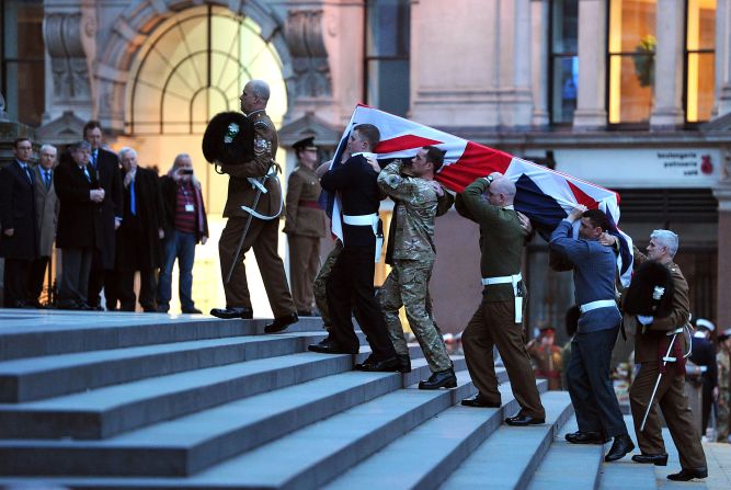 Bearer Party from the three military services carry a coffin up the steps of St Paul's Cathedral during the rehearsal for the ceremonial funeral.