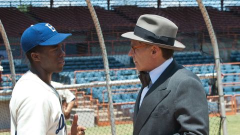 Chadwick Boseman stars as Jackie Robinson and Harrison Ford stars as Branch Rickey in the film "42."