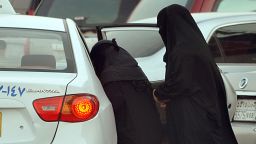 Saudi women get into a taxi outside a shopping mall in Riyadh on June 22, 2012.