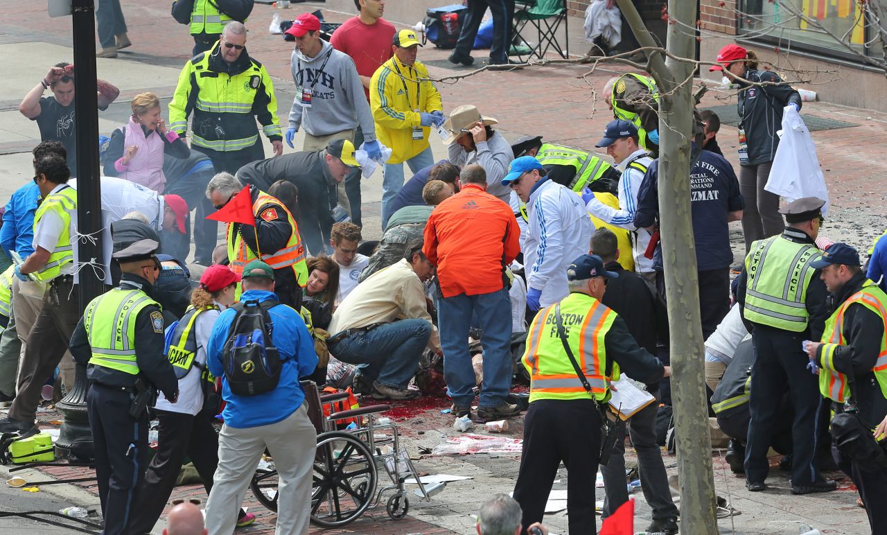 Police and emergency crews tend to victims.