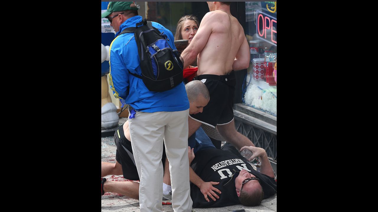 A man lies on the ground after the incident.