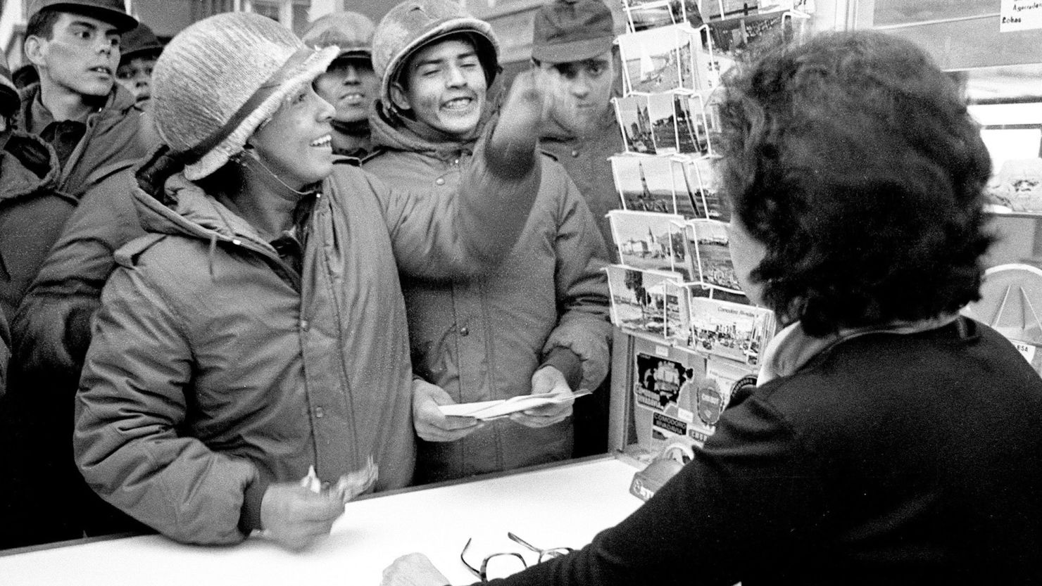 Argentine soldiers buy postcards at a souvenir shop in Stanley after they invaded the Falkland Islands in  April 1982.