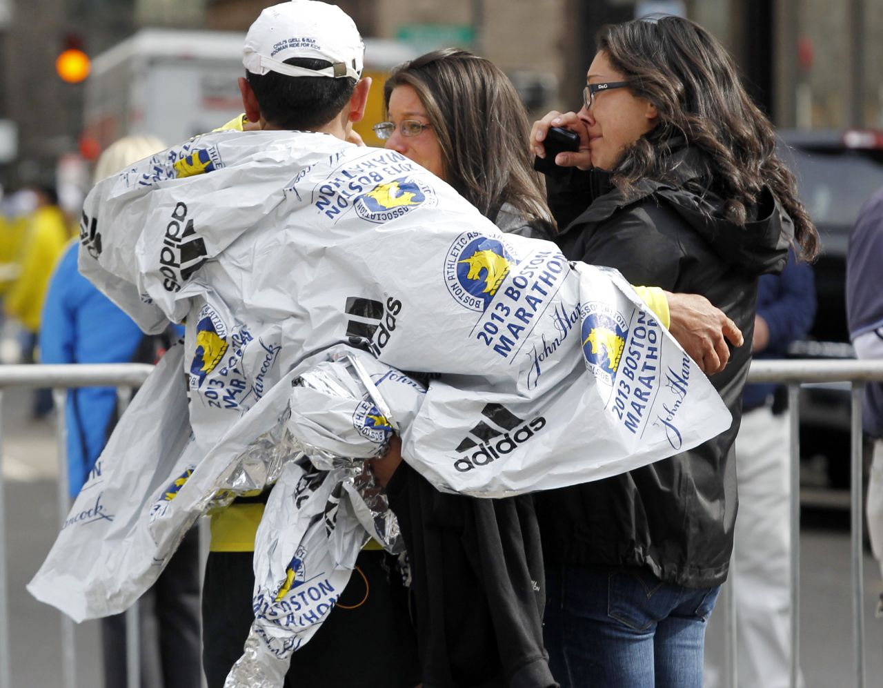 People comfort each near the site of the blasts.