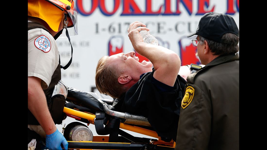 An injured man is loaded into an ambulance after two bombs went off near the finish line of the Boston Marathon on April 15, 2013. Three people were killed and at least 264 were injured.