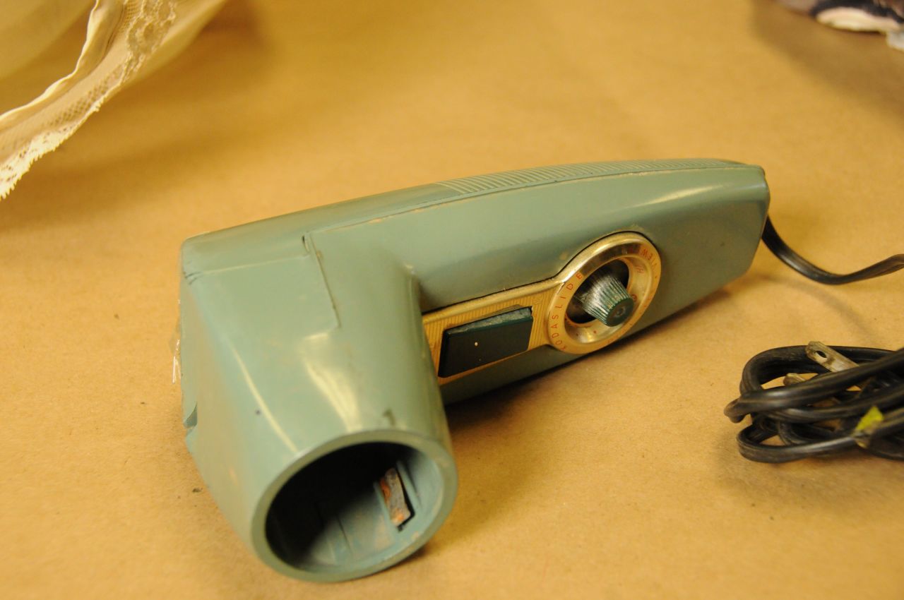 Next to Garza's body, police found this heavy Kodak metallic slide photo viewer, said former McAllen police officer Sonny Miller, who supervised crime scene investigations in 1960. Miller said investigators eventually learned the viewer belonged to the Rev. John Feit, a 27-year-old priest at Garza's church, Sacred Heart Catholic Church.<br />