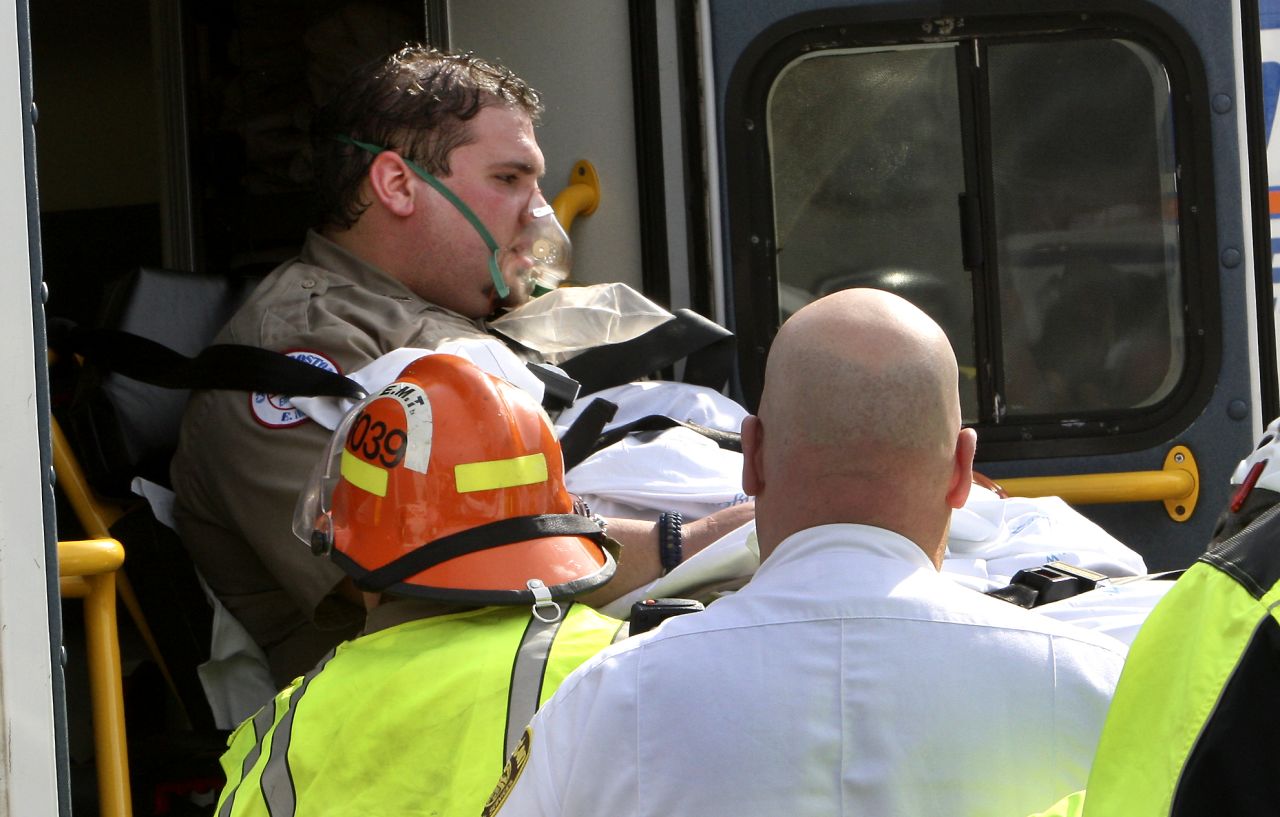 An EMT worker is transferred to an ambulance outside a medical tent in Copley Square.