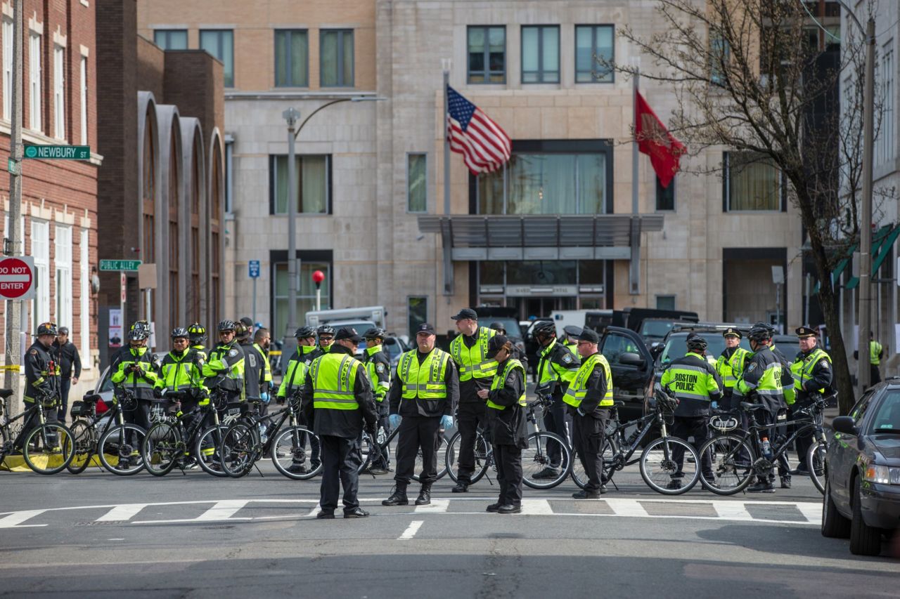 Police officers gather on Newbury Street.