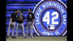 Matt Thornton, left, and  Alex Rios of the Chicago White Sox wait in the outfield during batting practice before the start of the game against the Toronto Blue Jays at Rogers Centre on Monday, April 15, in Toronto, Ontario, Canada. All baseball players wore jerseys with No. 42 in honor of Jackie Robinson Day. The Brooklyn Dodgers great, whose story is told in the new movie "42," was the first African-American to play Major League Baseball in the modern era. Robinson broke the color barrier on April 15, 1947.