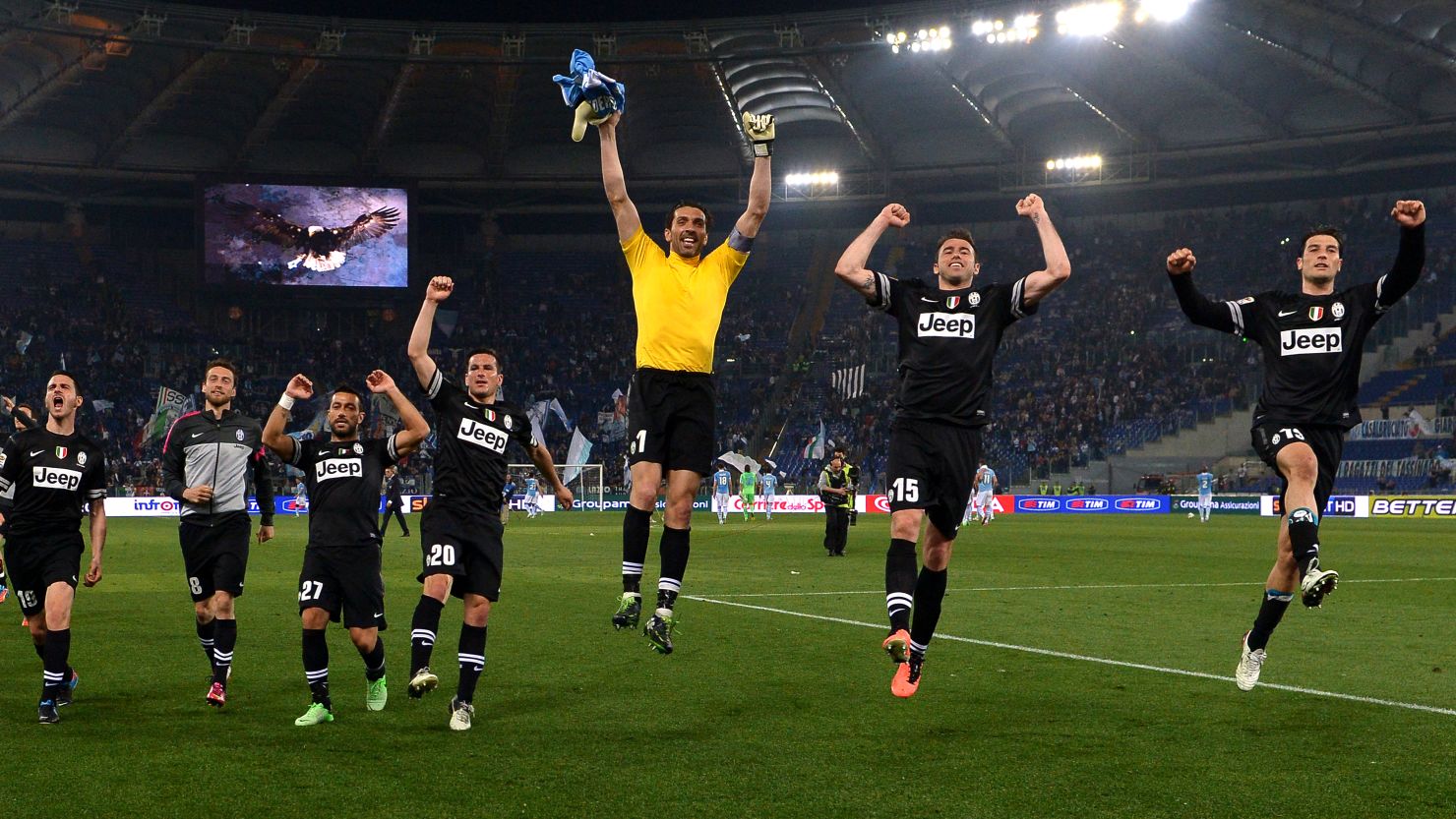 Juventus' players celebrate a decisive victory at Lazio that extends their lead at the top of Serie A to 11 points
