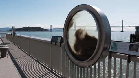 This installation teaches museumgoers about sediment in the Bay (with the Bay Bridge in the background).