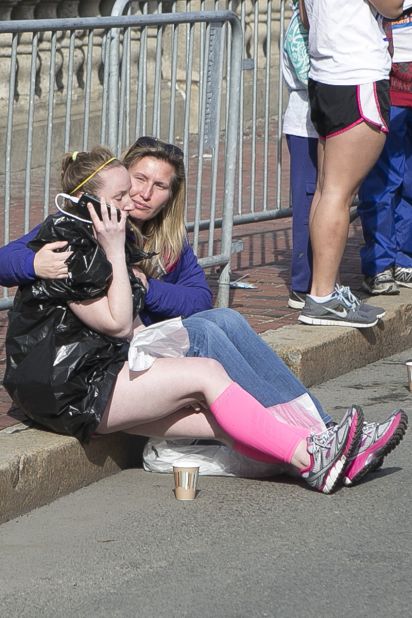As police led runners down a secure area, <a href="http://ireport.cnn.com/docs/DOC-957434">Catalano saw a woman run up crying uncontrollably.</a> She was wondering if her husband, who was at the finish line, was OK. Someone provided her with a phone, and she was able to contact her husband and make sure he was safe.   
