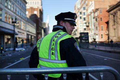 A  police officer stands on duty in Boston on April 16. 
