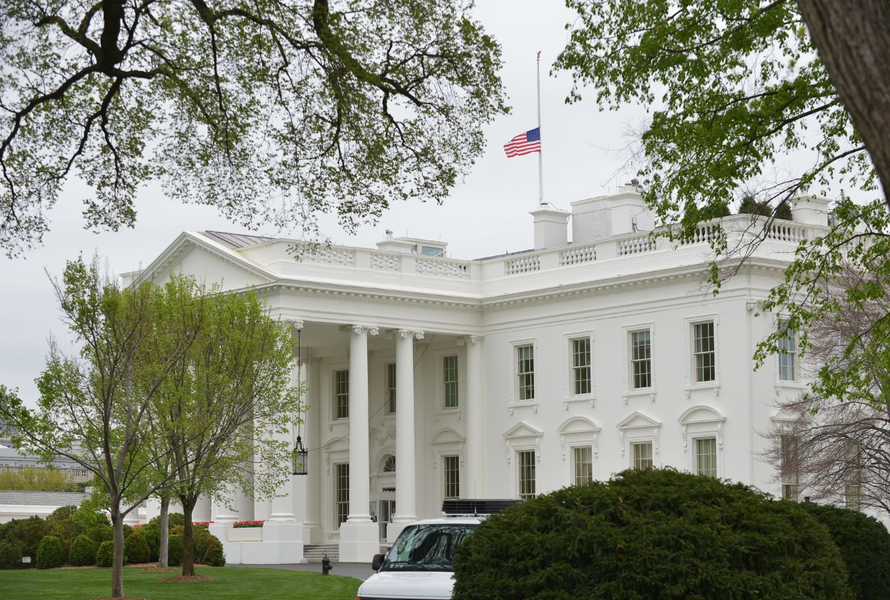 The flag above the White House flies at half-staff on April 16, 2013.