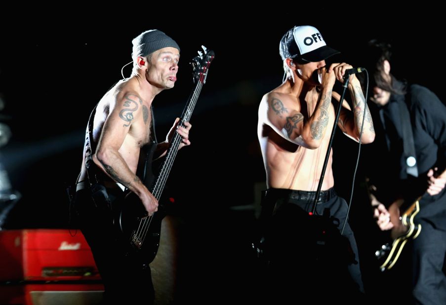 Flea and Anthony Kiedis of Red Hot Chili Peppers perform onstage.