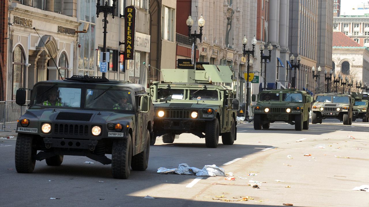 U.S. military Humvees move down deserted Boylston Street on April 16.