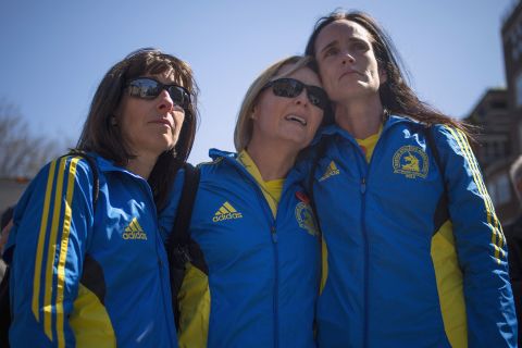 From left, Boston Marathon runners Tammy Snyder, Diane Deigmann and Lisa Kresky-Griffin embrace at the barricaded entrance to Boylston Street on April 16, 2013.