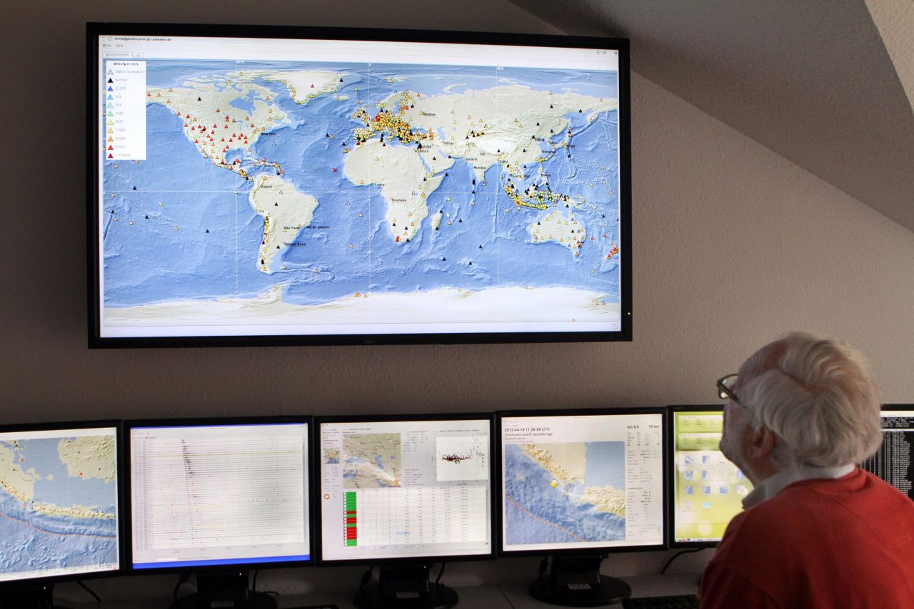 A scientist from the German Research Center for Geosciences looks at the earthquake region in southeast Iran on Tuesday from Potsdam, Germany.