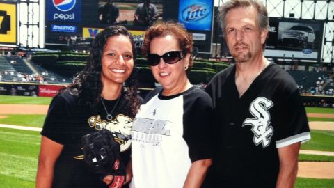 Vicki Rodriguez and her former foster parents, Linda and Ron Nemecek, at a White Sox game.