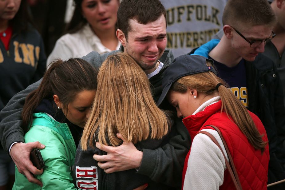 Mourners in Boston hug one another during a vigil for victims on April 16, 2013.