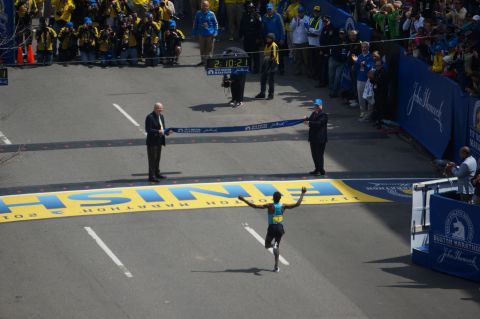 Ethiopian runner Lelisa Desisa, who won the men's marathon, reaches the finish line.